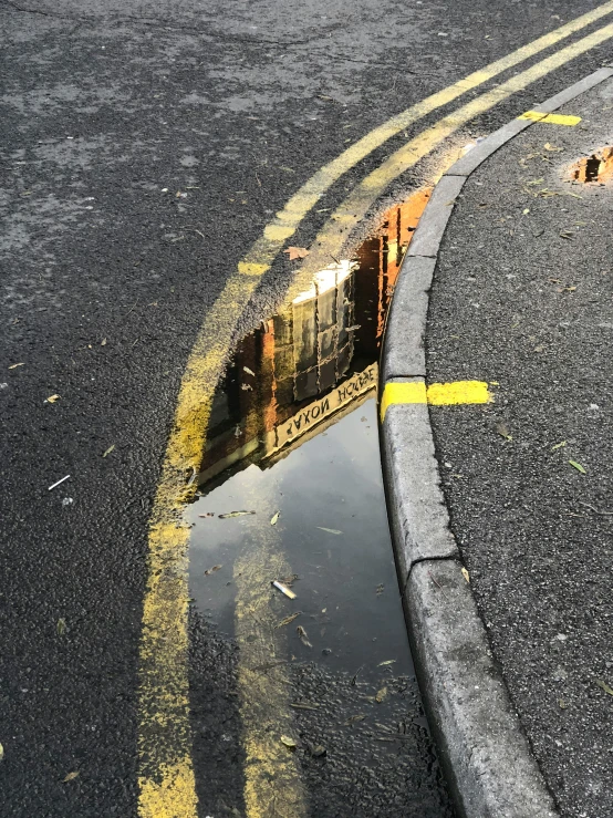 a reflection in water with a yellow mark