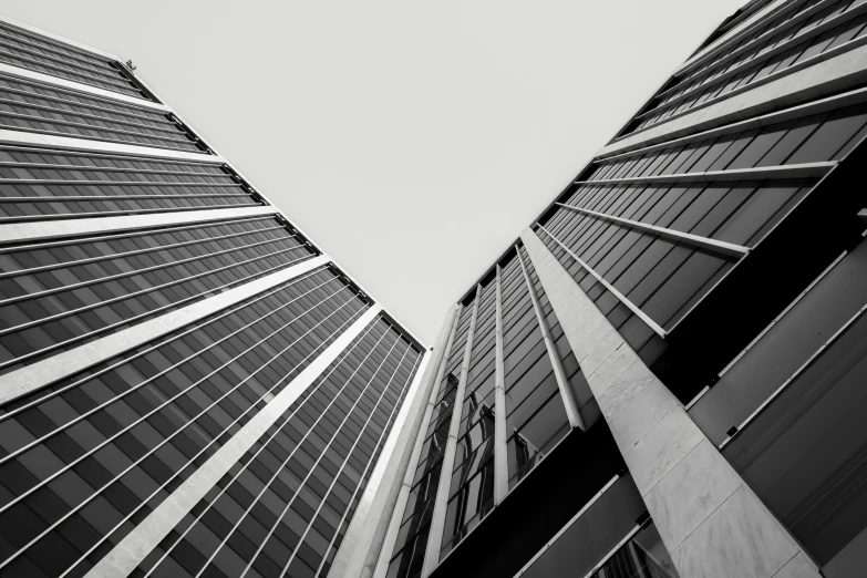 looking up at buildings in a black and white picture