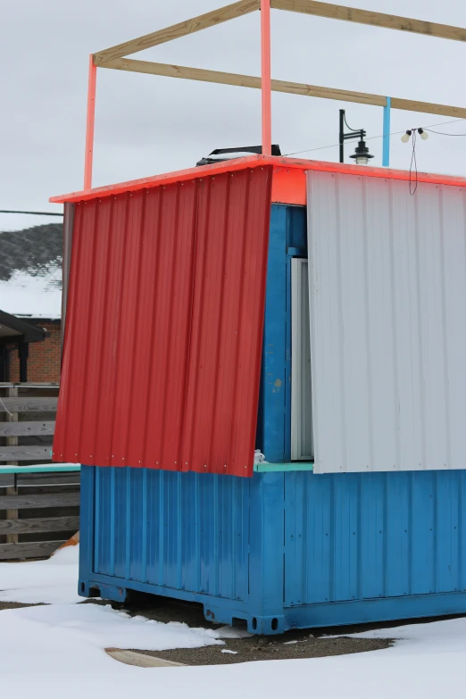 this is a storage unit with soing red, white, blue, and gray