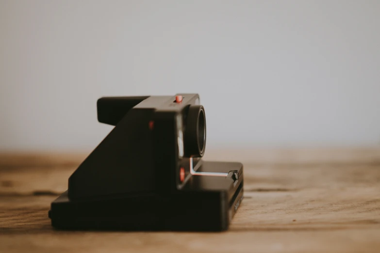 some cameras sitting on top of a table