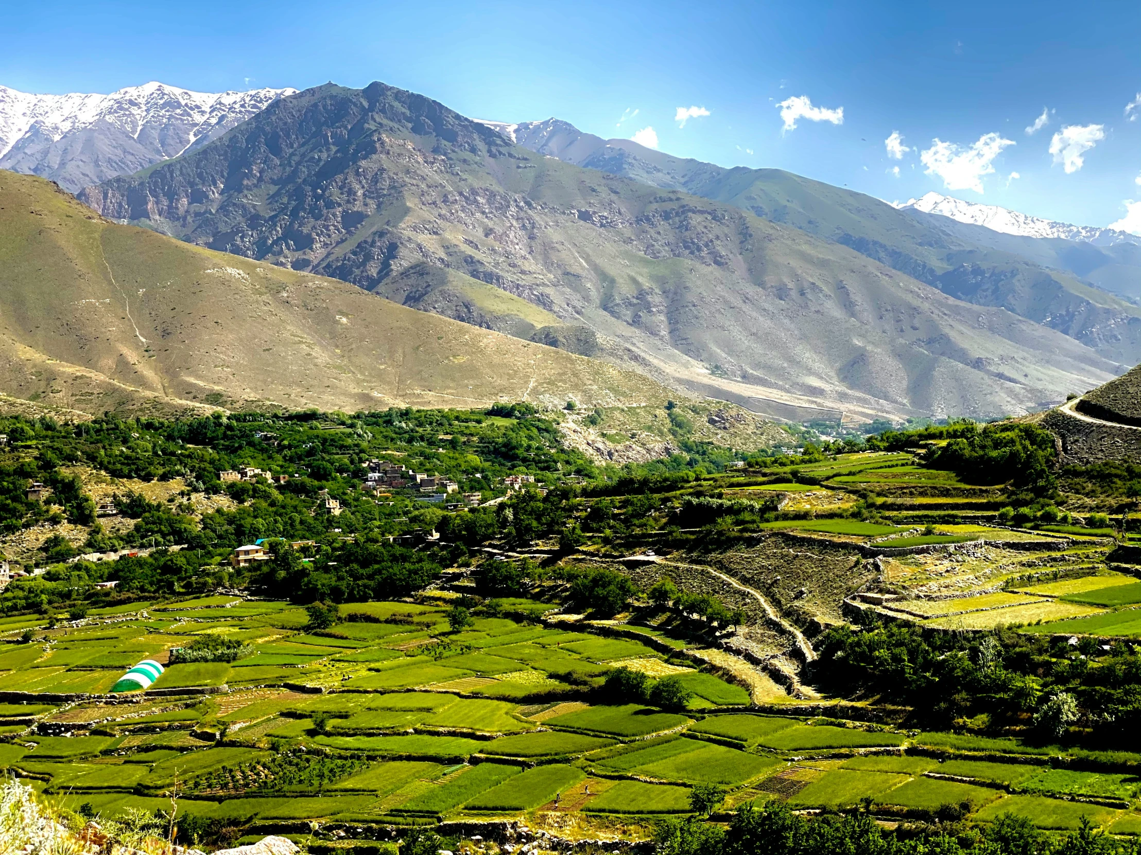 a view of mountains and valleys from an arid area