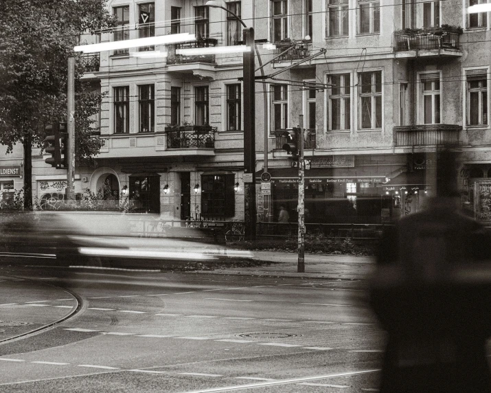 some buildings and a street light on a rainy day