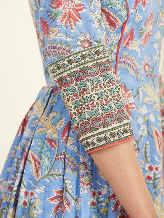 a close up view of a woman wearing a floral dress