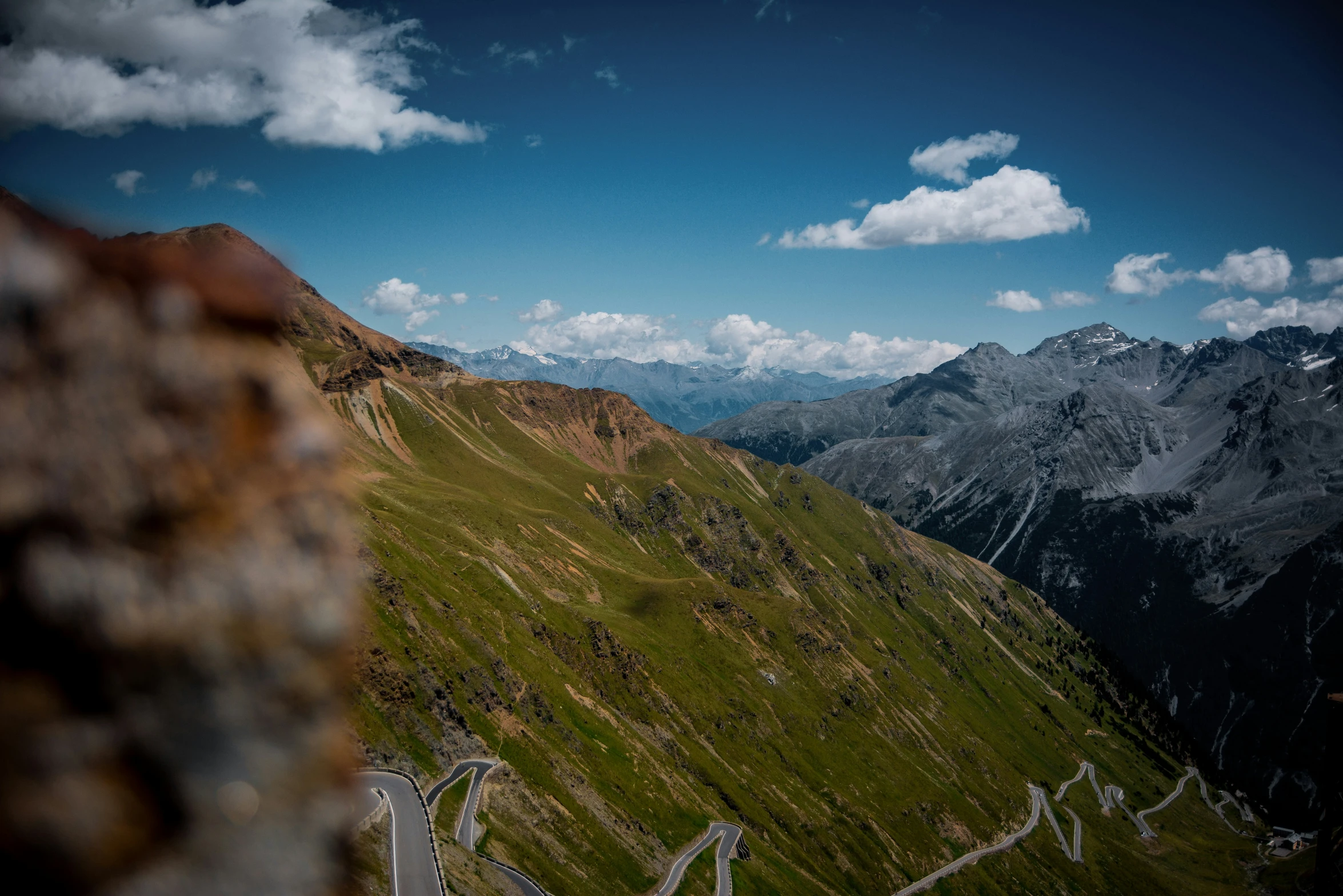 a road is in the middle of a mountain