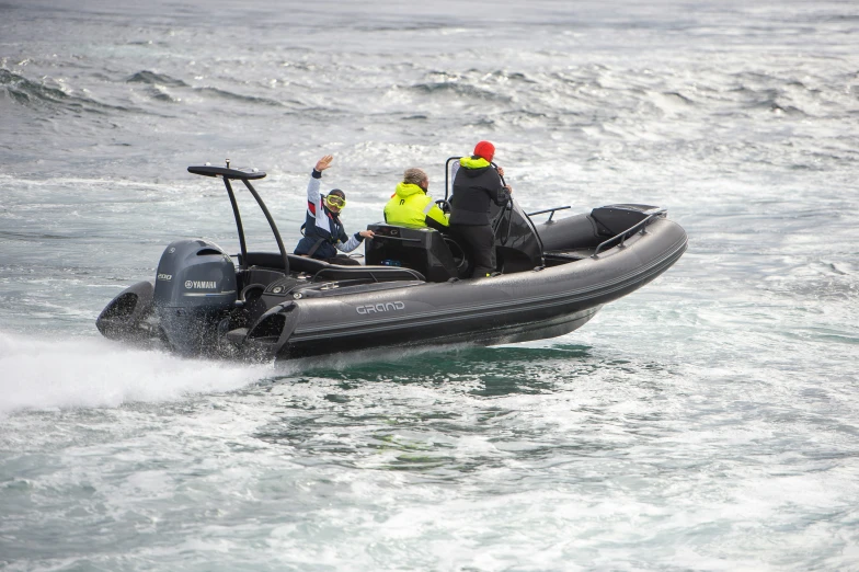 people riding in the back of a boat in water