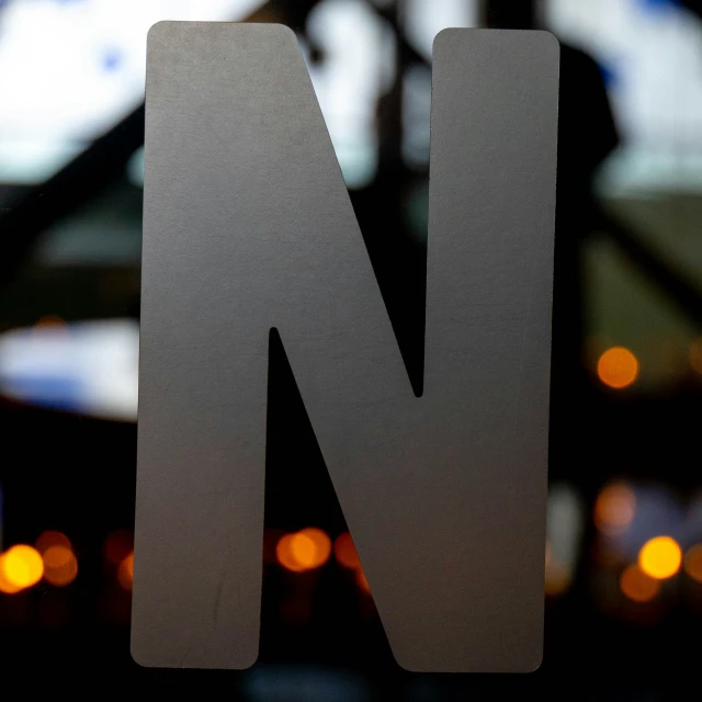 the letter n is inscribed in the center of the letter n