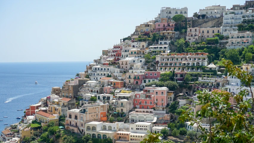 houses are on a cliff near the ocean