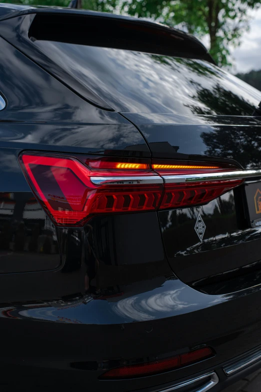 an interesting and unique chrome taillight on an automobile