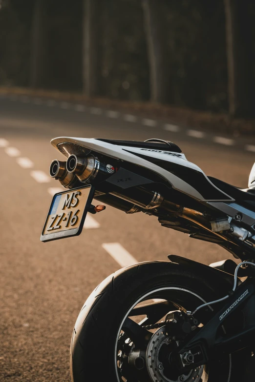 a motorcycle with a large metal license plate on the back