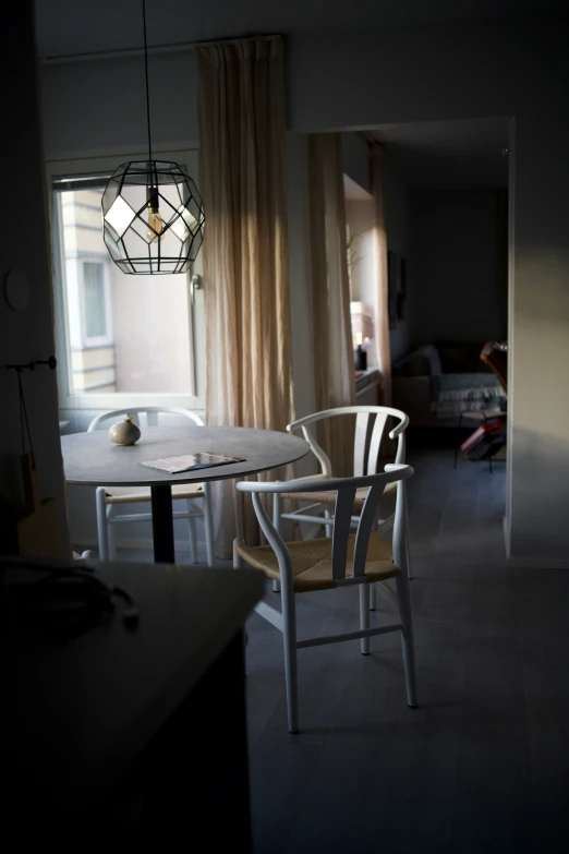 chairs and table are in the dark room