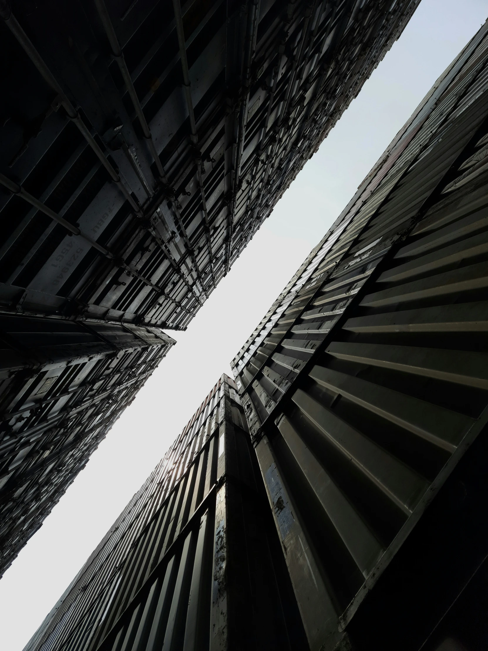 looking up at the tops of multiple metal structures