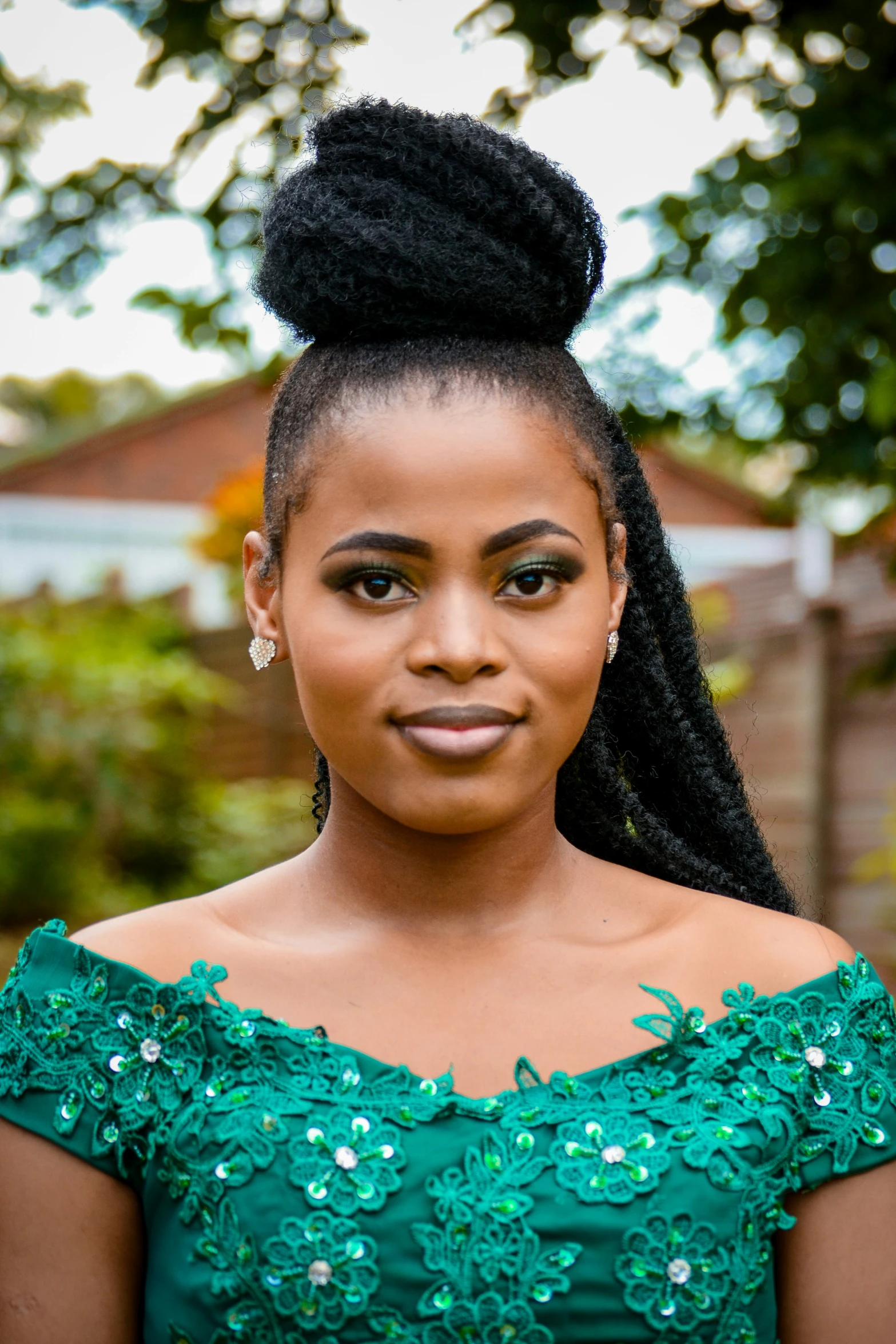 an african american woman in a green dress