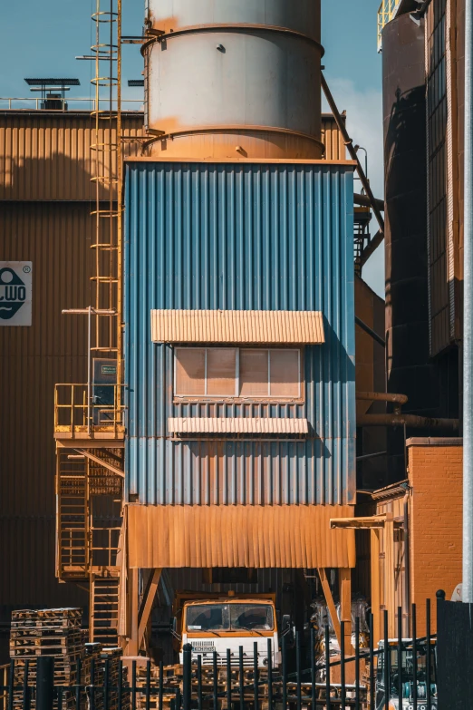 a large industrial tower building with an older one