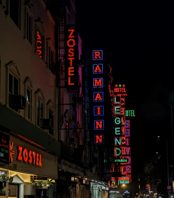 there is a el sign lit up at night