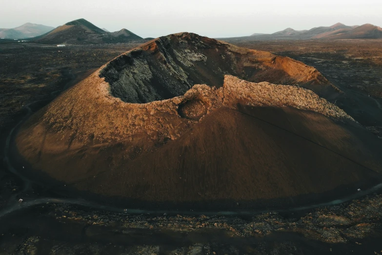 the view of a crater and mountain range