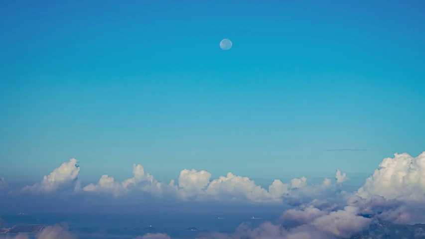 there is a plane flying through the sky with clouds