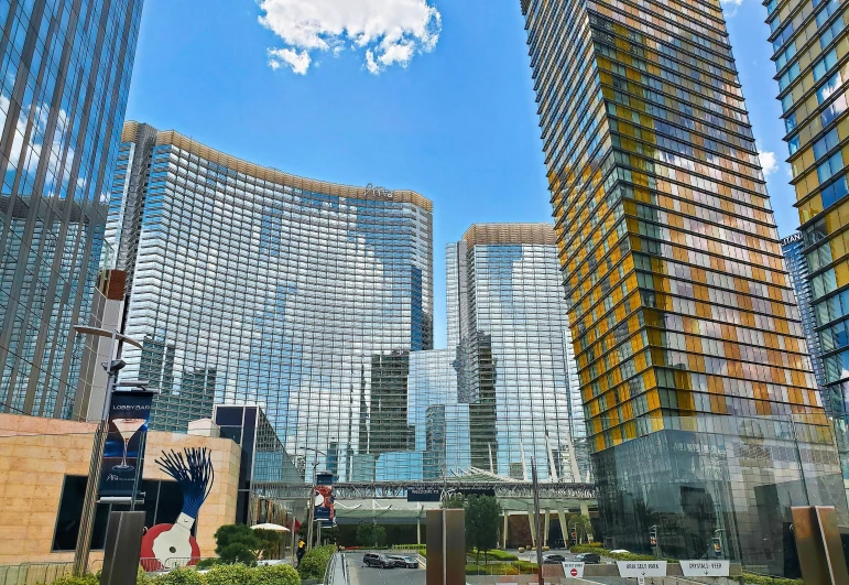 the mirrored facades of skyscrs are seen in this city