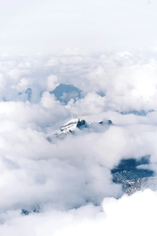 some clouds are around the mountains on this day