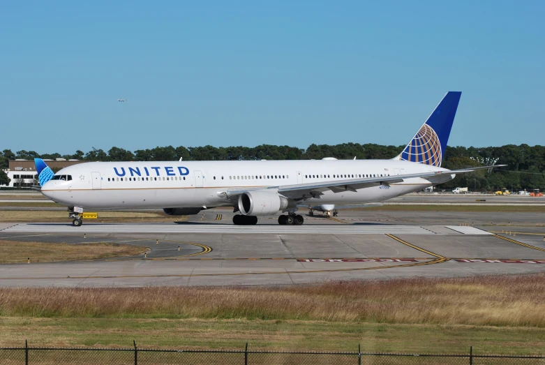 the plane is parked on the concrete as it travels