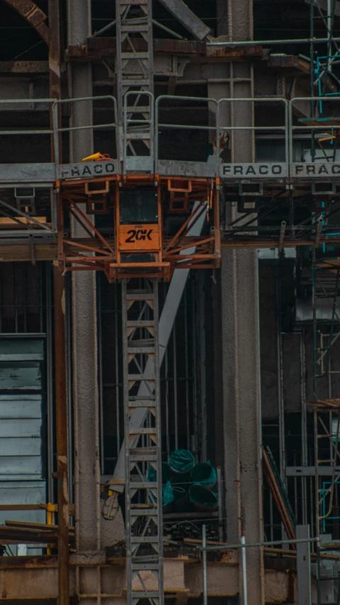 a tall tower in front of a building with a sign that reads 25k