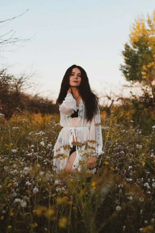 an image of a girl that is standing in the grass