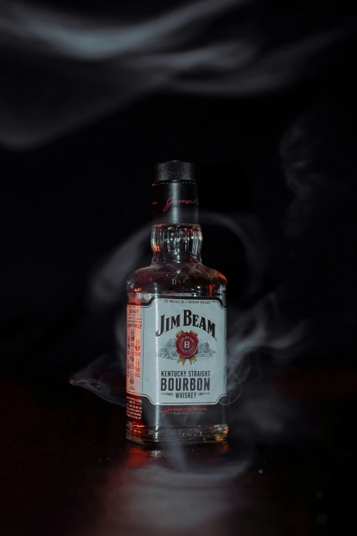 a bottle is shown with smoke behind it