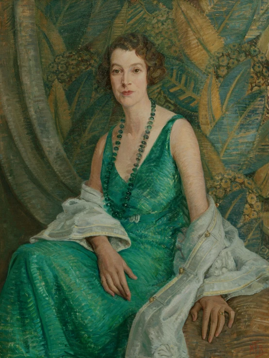 a portrait of a lady in green sitting on a couch