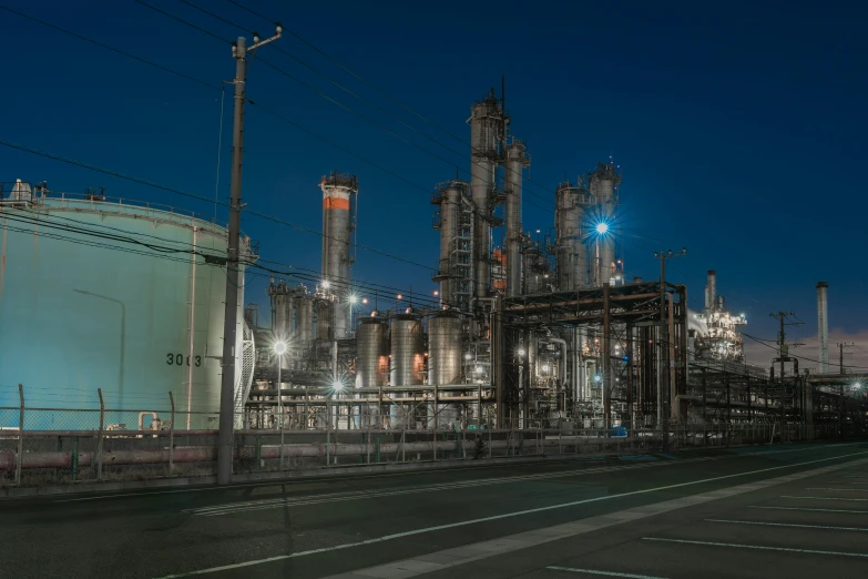 oil refinery with lots of lights at night