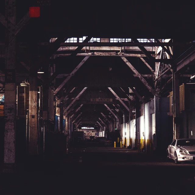 there is an empty road at night in the city