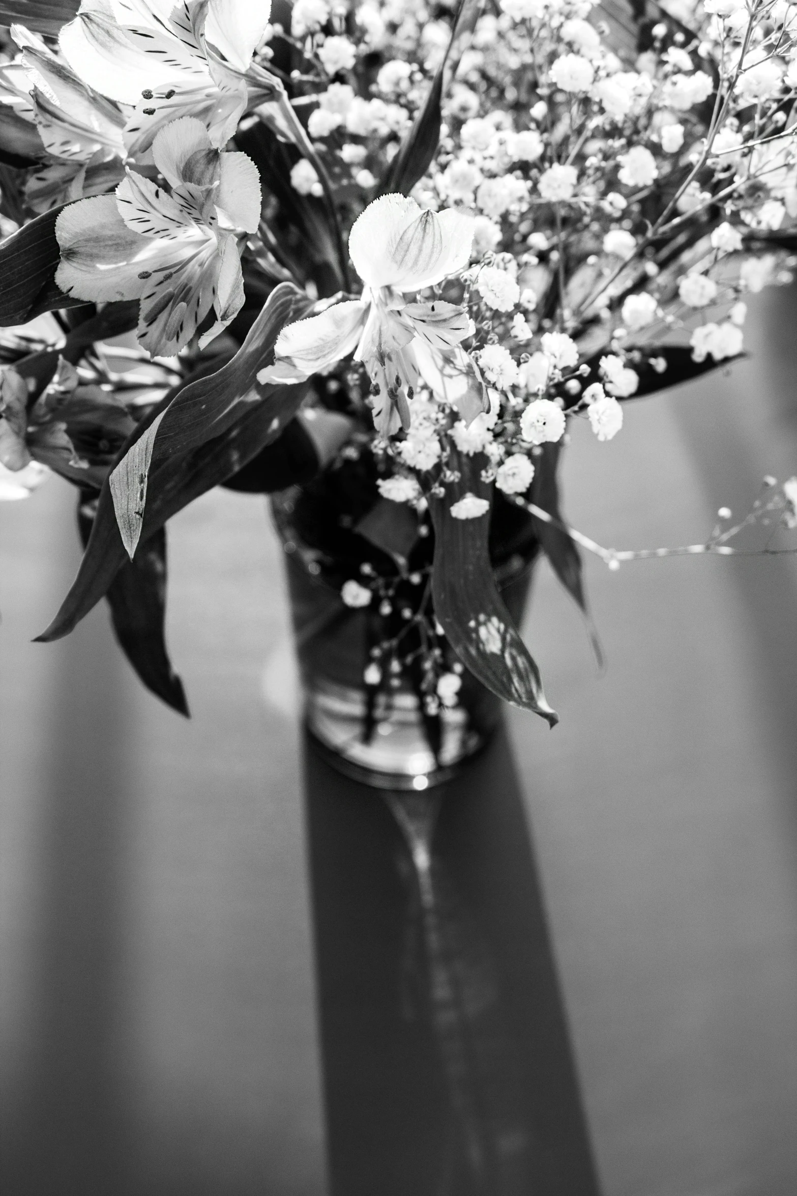 a vase of flowers sitting on a table