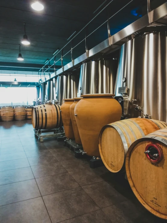 a row of wooden barrels in a dark room