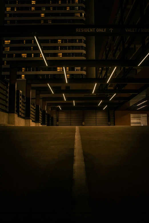 an empty parking garage in a city at night
