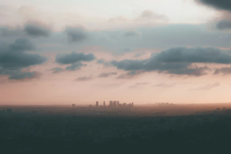 the sky is gray and cloudy, with some buildings in the distance