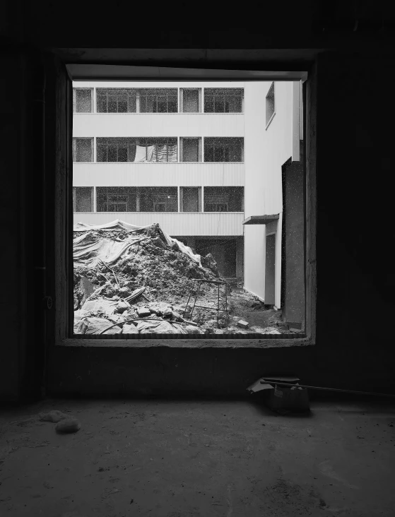 the view of a large building is seen from outside of a window