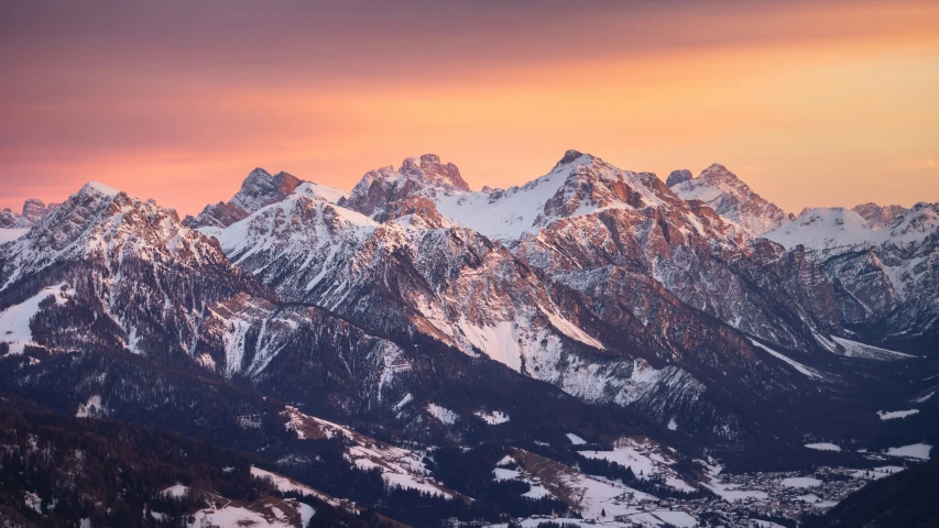 the mountain tops with some very high mountains in the background