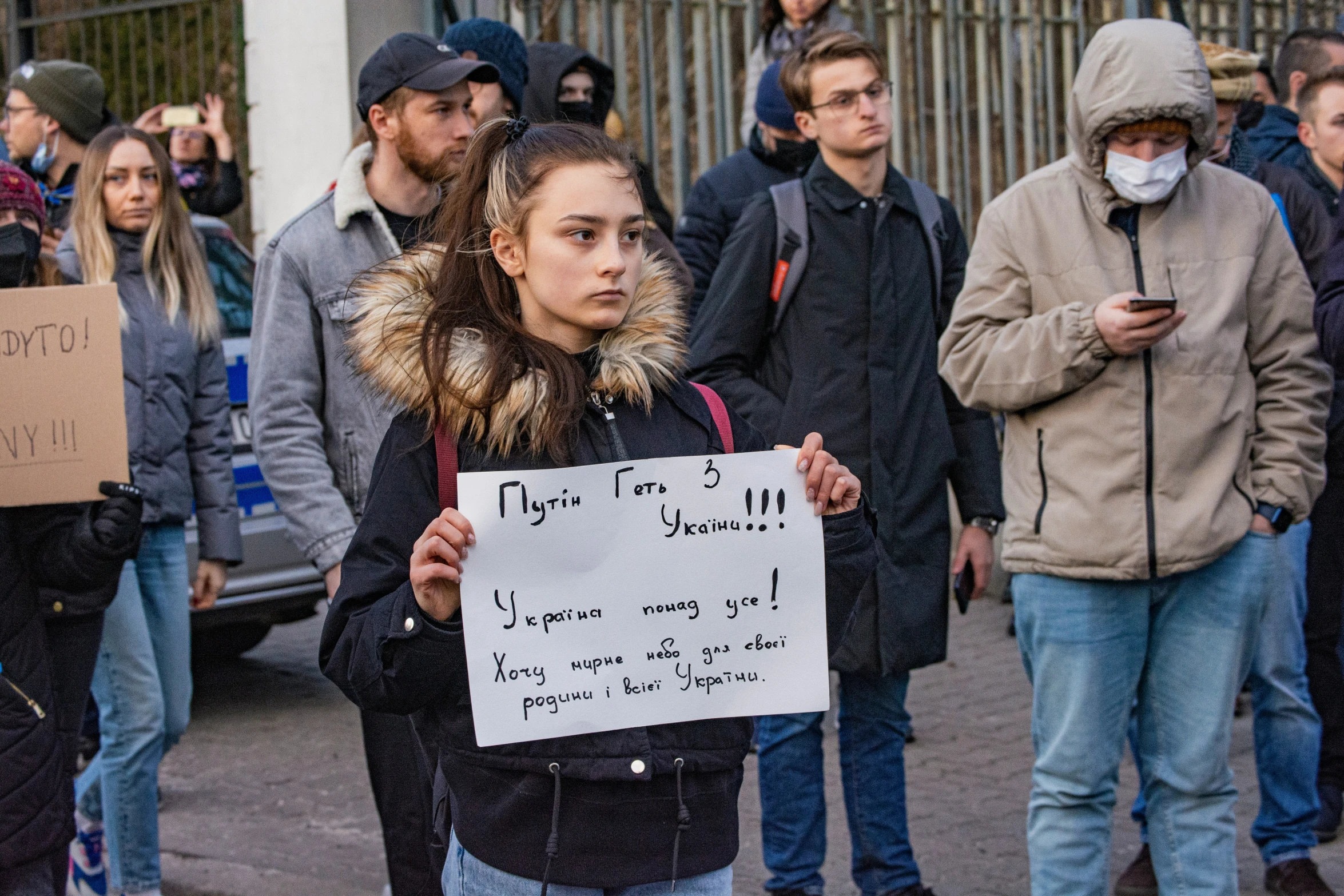 the young people stand in line with their backs against each other