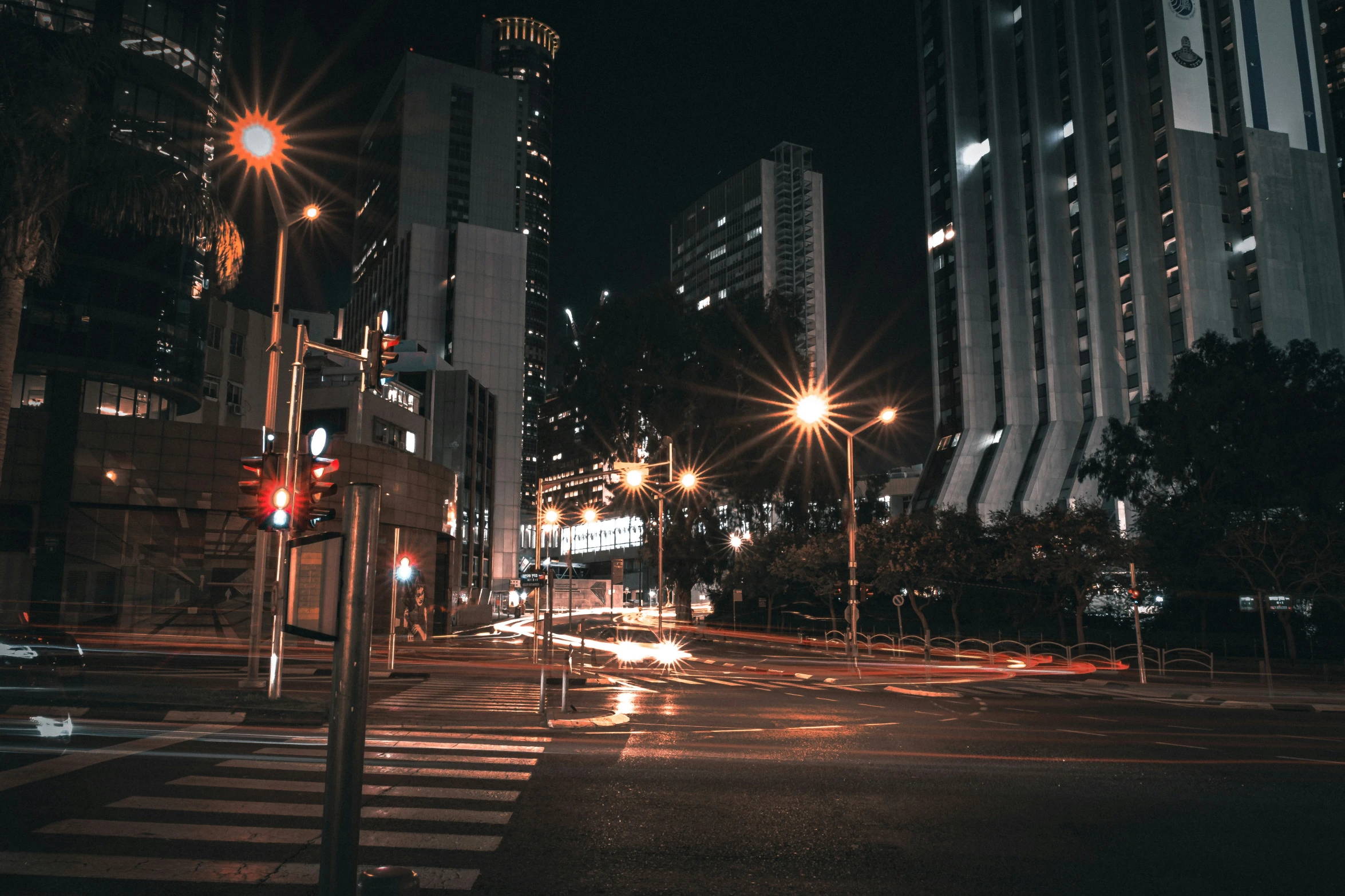 a night scene with a busy intersection and street lights