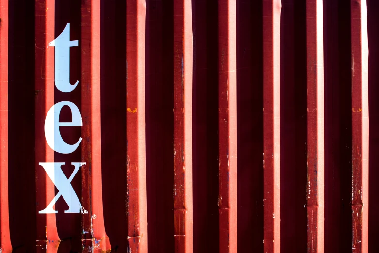 a large red container with the letters t e yx on it