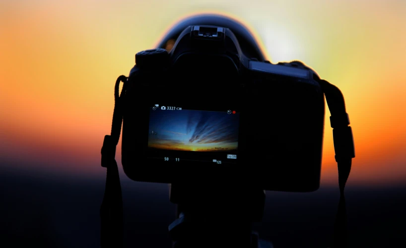 a camera that is set up with the sky in background