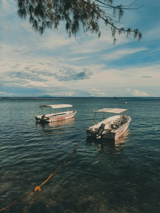 two empty boats that are sitting in the water