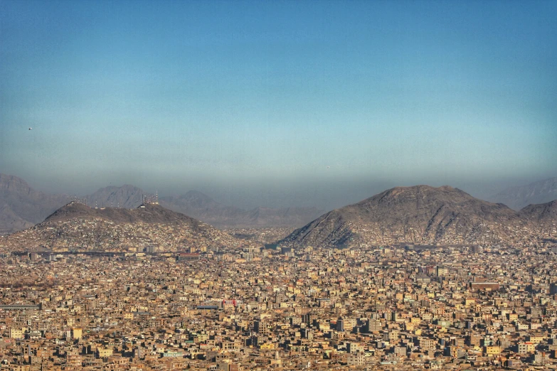 the aerial view of the city of mexico shows large mountains