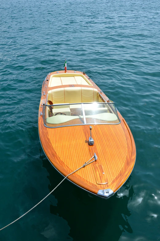 a small speed boat tied up to the boat