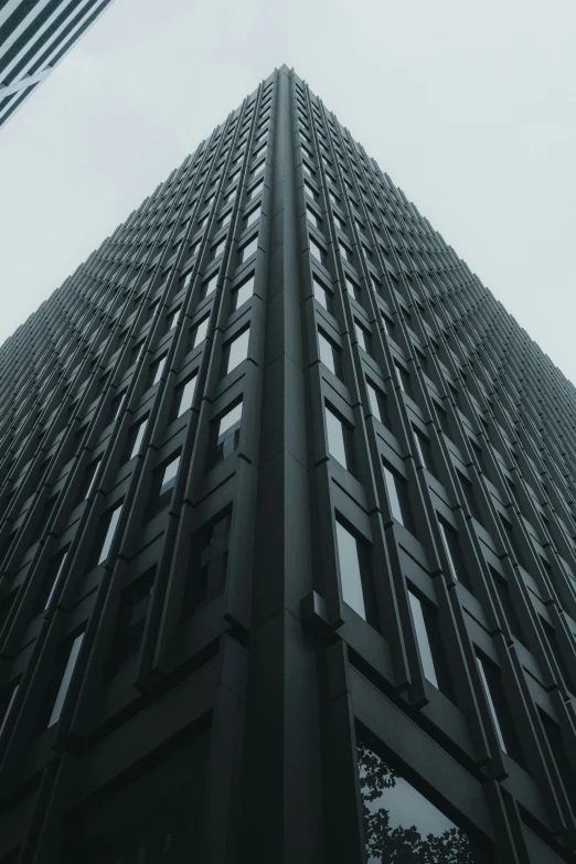 looking up at a tall skyscr building