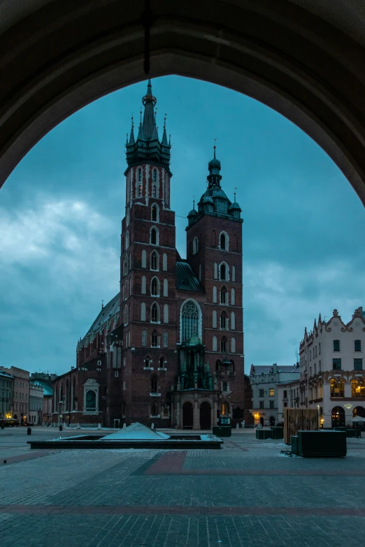 a view from an arch in front of a large building