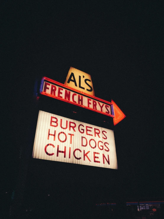 two colorful signs above a  dog joint