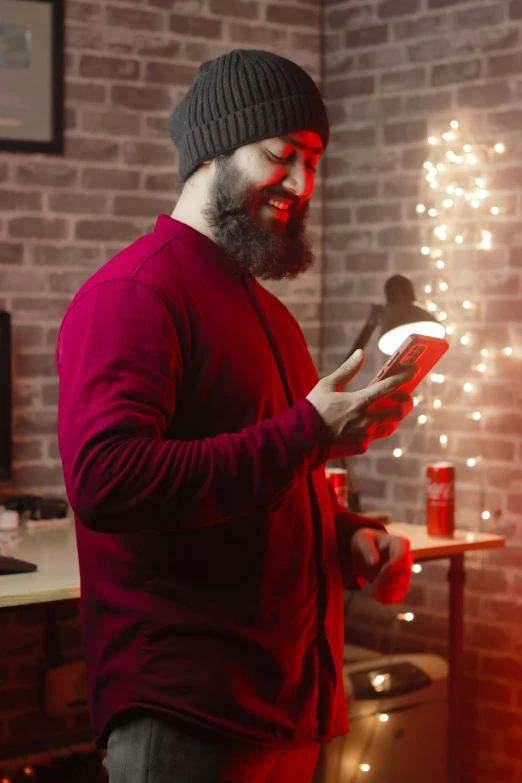 a bearded man with a beard is looking at soing on a tablet