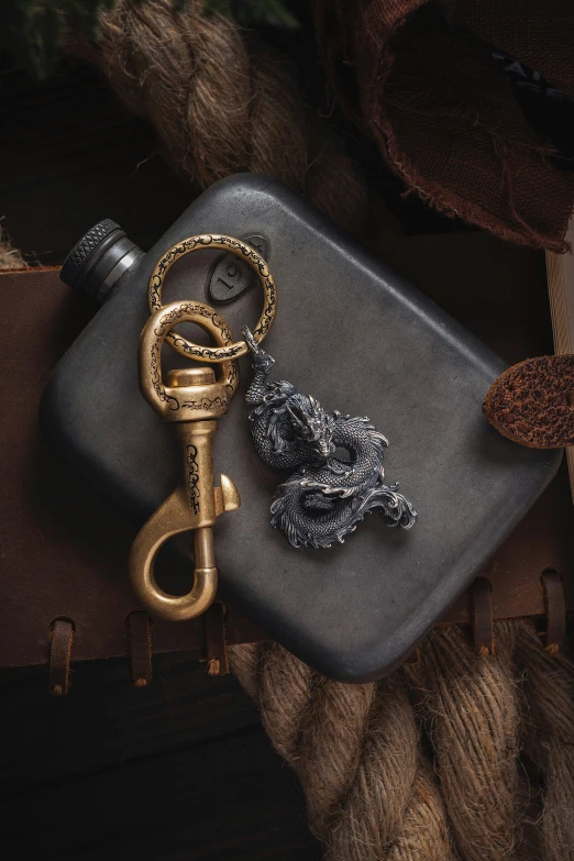 a bottle and some items sitting on a silver container