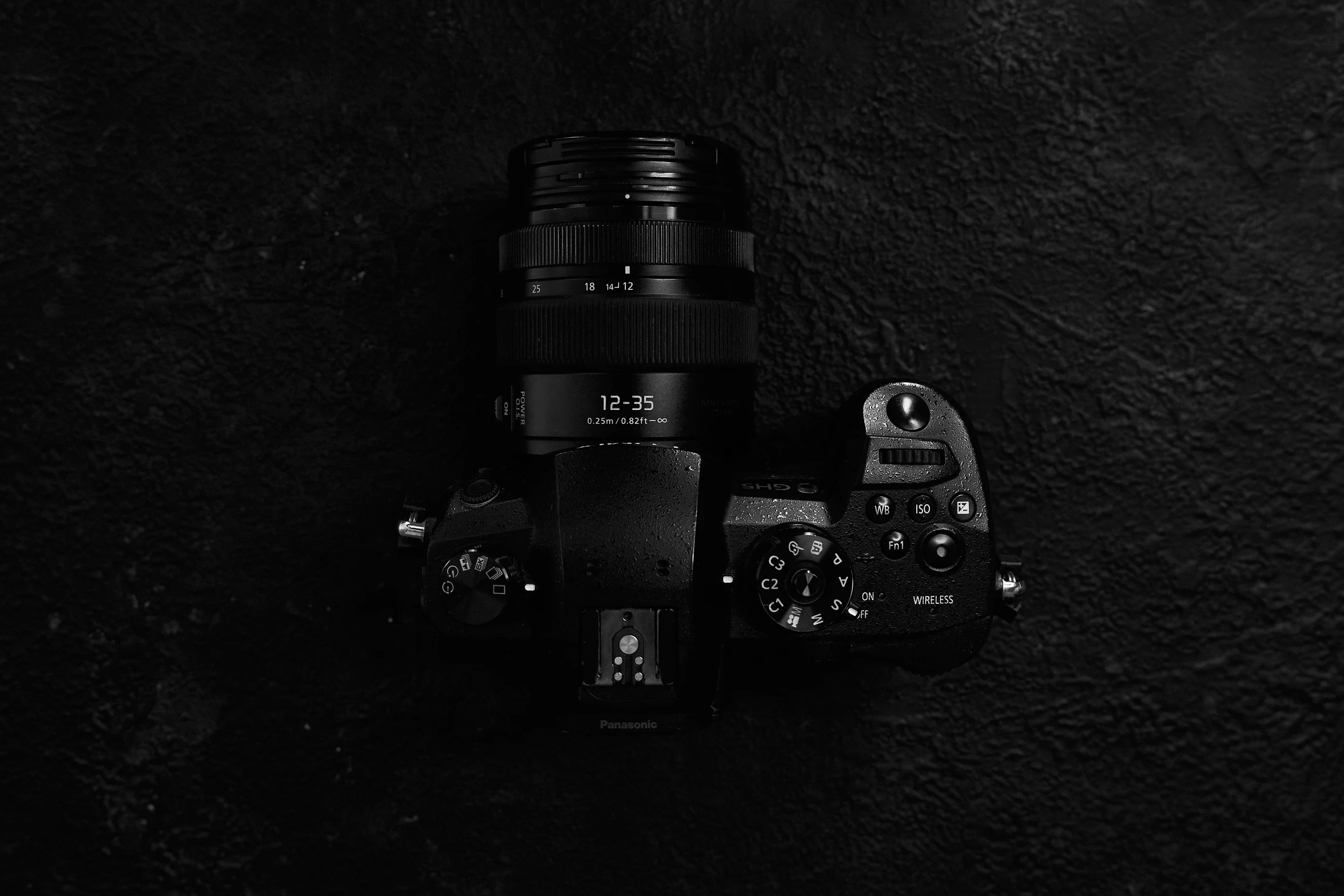 black and white po of a camera on black background