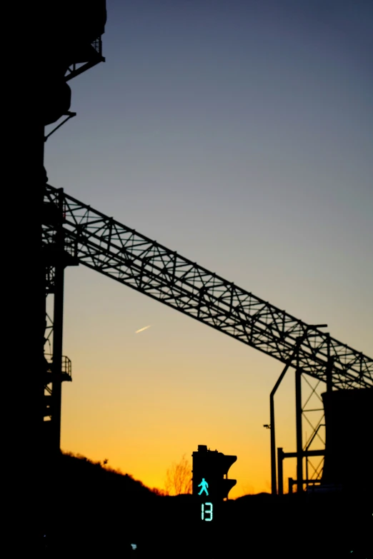 silhouetted building on an almost empty street at dusk