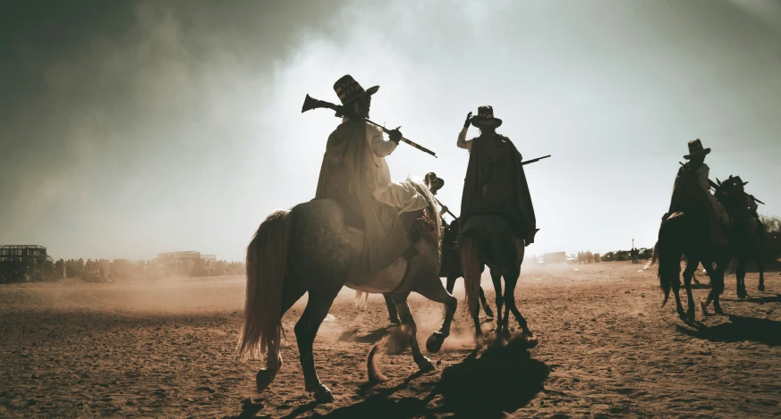 two men dressed in cowboy gear ride horses